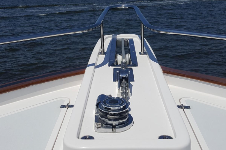 Boat windlass and anchor chain on a yacht deck