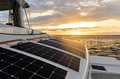 Solar panel on boat in sea with sunset